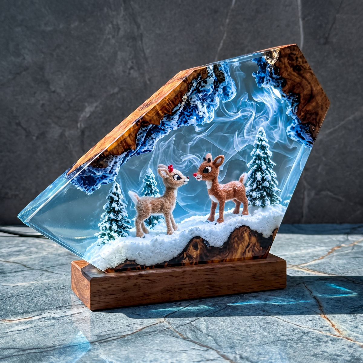 Winter Fawns resin lamp glowing on stone